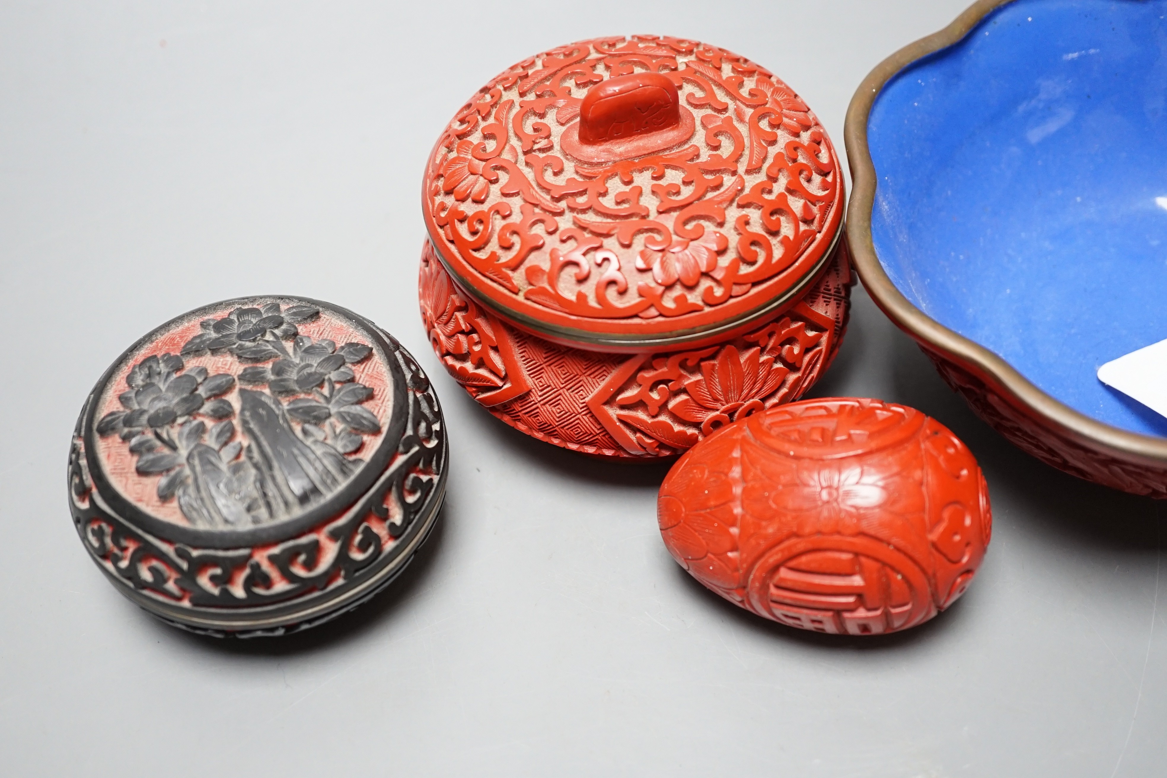 A Chinese cinnabar lacquer bowl, a similar covered box and egg, and a carved circular box and cover